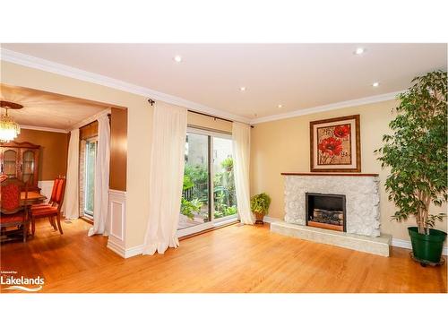 P13-25 Redstone Path, Toronto, ON - Indoor Photo Showing Living Room With Fireplace