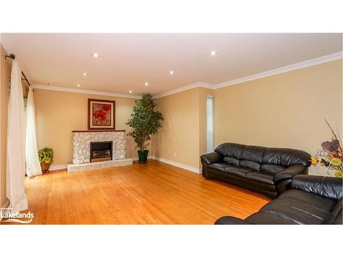 P13-25 Redstone Path, Toronto, ON - Indoor Photo Showing Living Room With Fireplace