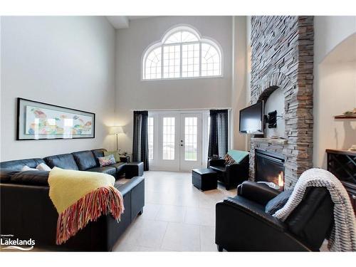 10-209707 26 Highway, The Blue Mountains, ON - Indoor Photo Showing Living Room With Fireplace