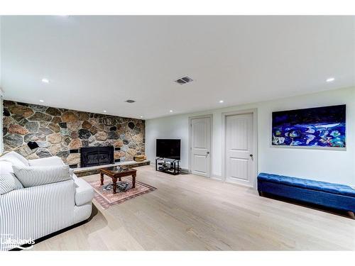 63 Rodrium Road, Wasaga Beach, ON - Indoor Photo Showing Living Room With Fireplace