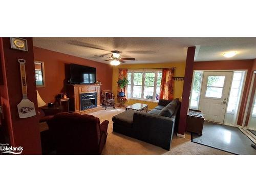 11 Herons Hill, Bracebridge, ON - Indoor Photo Showing Living Room With Fireplace