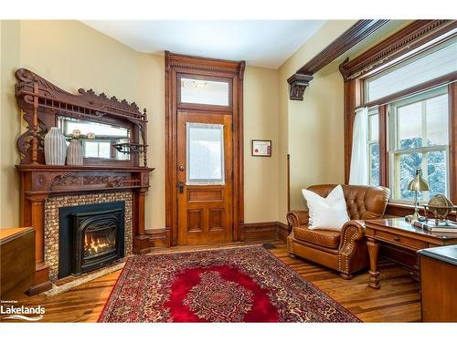 18 Amelia Street, Springwater, ON - Indoor Photo Showing Living Room With Fireplace