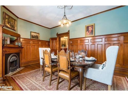 18 Amelia Street, Springwater, ON - Indoor Photo Showing Dining Room With Fireplace