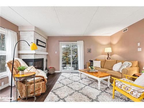 390 Mariners Way, Collingwood, ON - Indoor Photo Showing Living Room With Fireplace