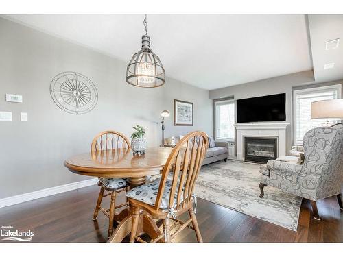 308-4 Brandy Lane Drive, Collingwood, ON - Indoor Photo Showing Dining Room With Fireplace