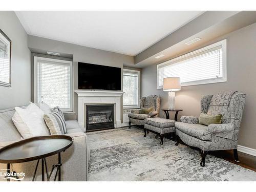 308-4 Brandy Lane Drive, Collingwood, ON - Indoor Photo Showing Living Room With Fireplace