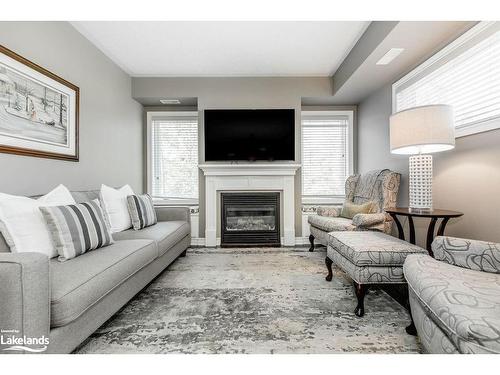 308-4 Brandy Lane Drive, Collingwood, ON - Indoor Photo Showing Living Room With Fireplace