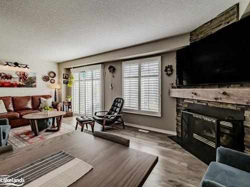 42 Shoreline Drive, Bracebridge, ON - Indoor Photo Showing Living Room With Fireplace