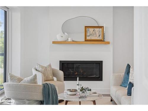 308-19B West Street N, Fenelon Falls, ON - Indoor Photo Showing Living Room With Fireplace