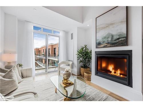 Ph617-1 Hume Street, Collingwood, ON - Indoor Photo Showing Living Room With Fireplace