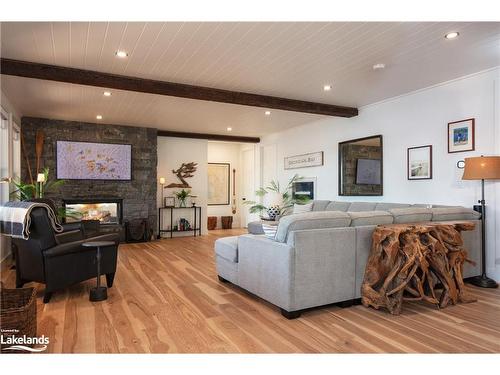 32 A11 Island, Pointe Au Baril, ON - Indoor Photo Showing Living Room With Fireplace