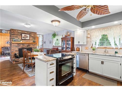 269 Old Muskoka Rd S, South River, ON - Indoor Photo Showing Kitchen With Fireplace