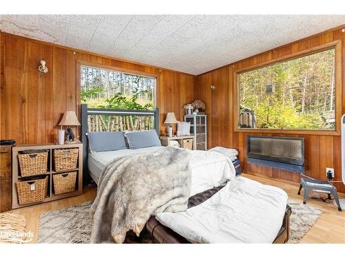 165 James Camp Road, Burk'S Falls, ON - Indoor Photo Showing Bedroom With Fireplace