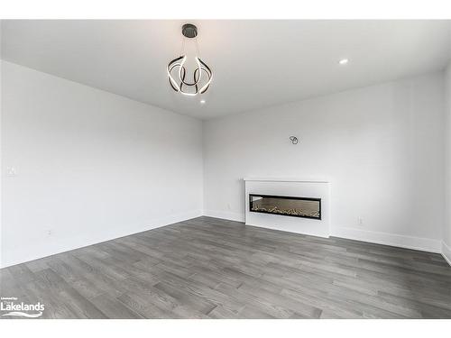 18 Lakeshore Road, Wasaga Beach, ON - Indoor Photo Showing Living Room With Fireplace