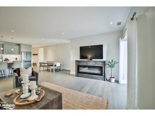 002-727 Grandview Drive, Huntsville, ON - Indoor Photo Showing Living Room With Fireplace