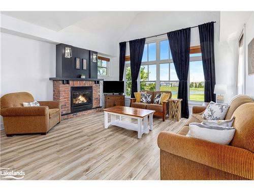 211-115 Fairway Court, The Blue Mountains, ON - Indoor Photo Showing Living Room With Fireplace