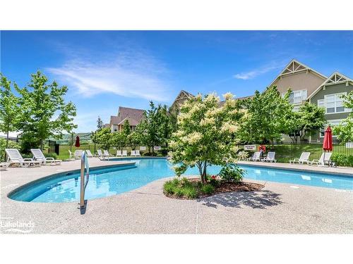 211-115 Fairway Court, The Blue Mountains, ON - Outdoor With In Ground Pool With Backyard