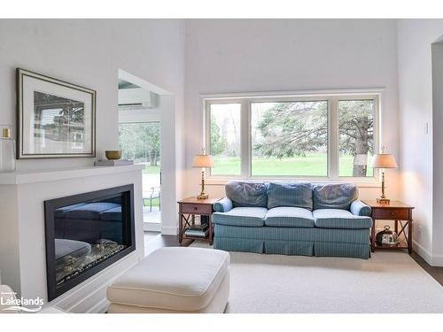 2-15 Golf Course Road, Bracebridge, ON - Indoor Photo Showing Living Room With Fireplace