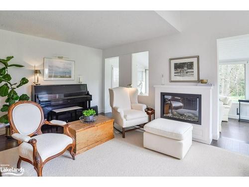 2-15 Golf Course Road, Bracebridge, ON - Indoor Photo Showing Living Room With Fireplace