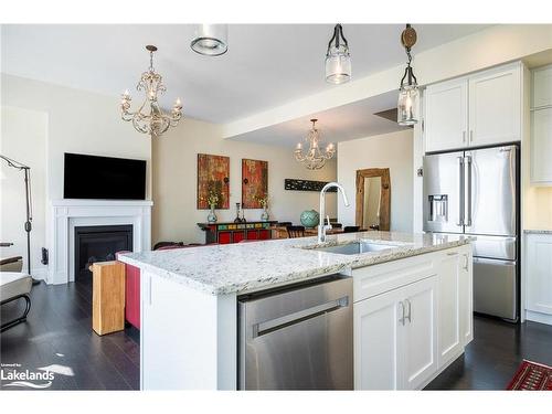 31 Emerson Mews, Collingwood, ON - Indoor Photo Showing Kitchen With Fireplace With Upgraded Kitchen