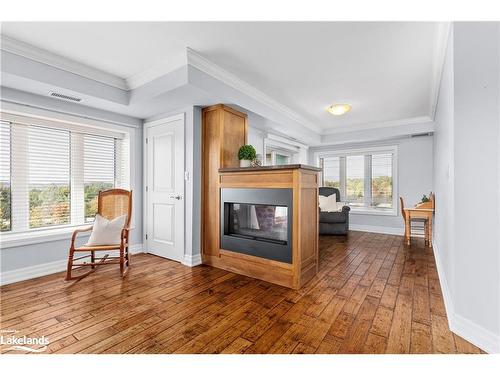 402-26 Dairy Lane, Huntsville, ON - Indoor Photo Showing Other Room With Fireplace