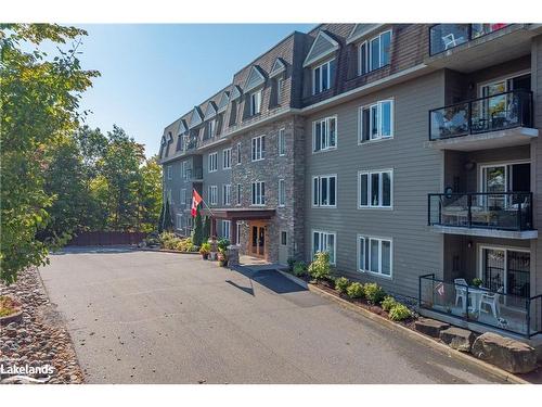 402-26 Dairy Lane, Huntsville, ON - Outdoor With Balcony With Facade