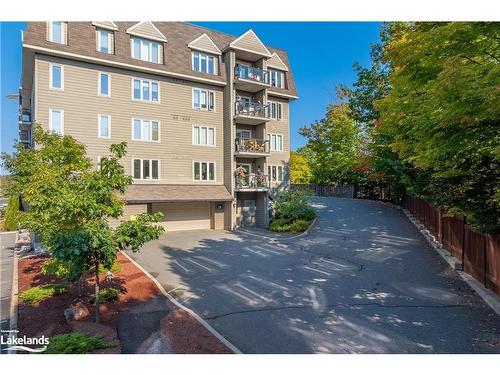 402-26 Dairy Lane, Huntsville, ON - Outdoor With Balcony With Facade