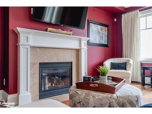 701-40 Trott Boulevard, Collingwood, ON - Indoor Photo Showing Living Room With Fireplace