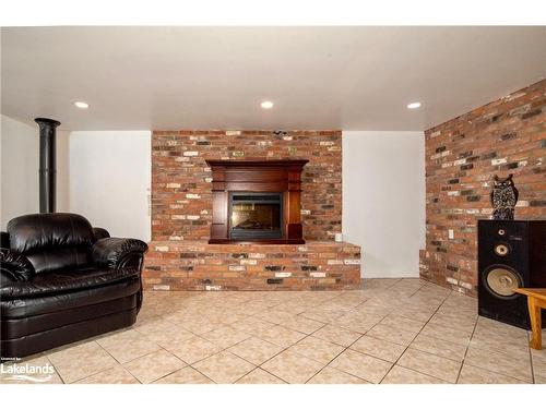 316 Goreville Road, South River, ON - Indoor Photo Showing Living Room With Fireplace