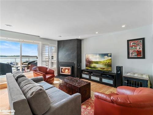 214-603 Atherley Road, Orillia, ON - Indoor Photo Showing Living Room With Fireplace