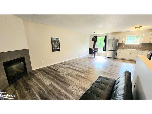 33-200 Pine Street, Bracebridge, ON - Indoor Photo Showing Living Room With Fireplace