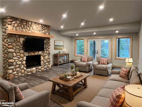 3 Rowntree Lane, Whitestone, ON - Indoor Photo Showing Living Room With Fireplace