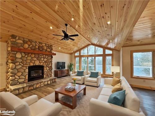 3 Rowntree Lane, Whitestone, ON - Indoor Photo Showing Living Room With Fireplace