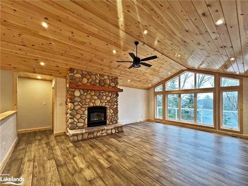 3 Rowntree Lane, Whitestone, ON - Indoor Photo Showing Living Room With Fireplace