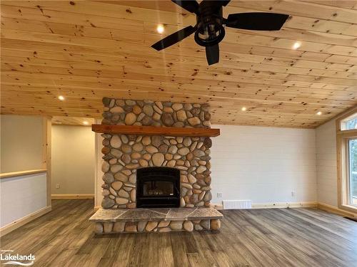 3 Rowntree Lane, Whitestone, ON - Indoor Photo Showing Living Room With Fireplace