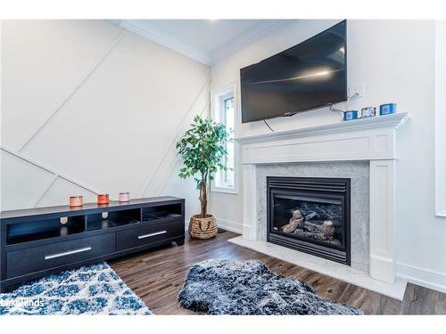 99 Mcintyre Drive, Barrie, ON - Indoor Photo Showing Living Room With Fireplace