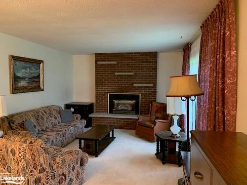 245 Lakewood Park Road, Huntsville, ON - Indoor Photo Showing Living Room With Fireplace