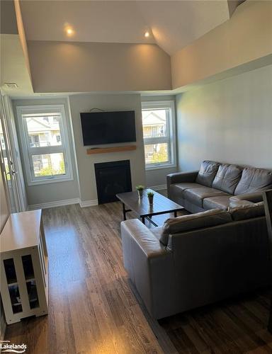 302-5 Anchorage Crescent, Collingwood, ON - Indoor Photo Showing Living Room With Fireplace