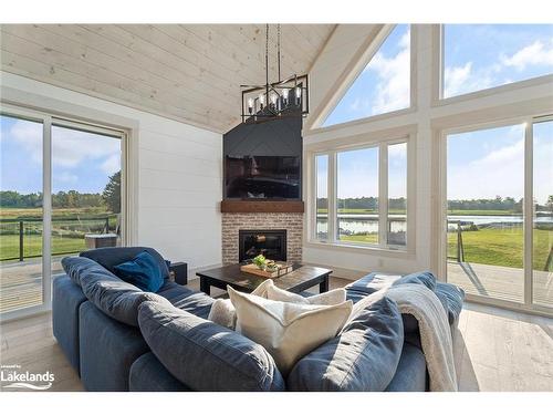 1038 Boyes Bridge Lane, Gravenhurst, ON - Indoor Photo Showing Living Room With Fireplace