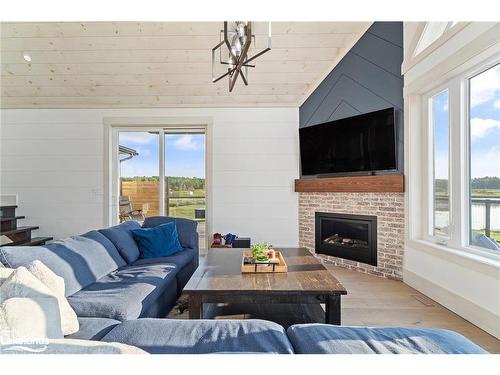 1038 Boyes Bridge Lane, Gravenhurst, ON - Indoor Photo Showing Living Room With Fireplace