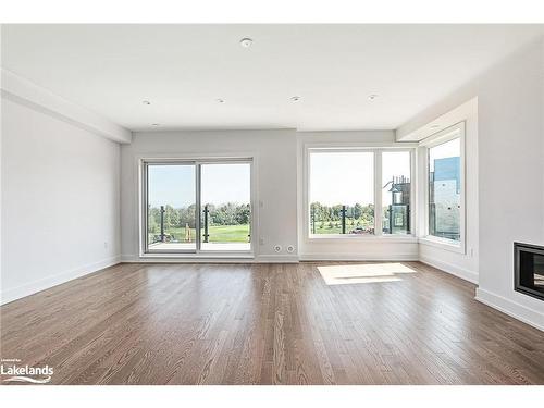 20-117 Sladden Court, Thornbury, ON - Indoor Photo Showing Other Room With Fireplace