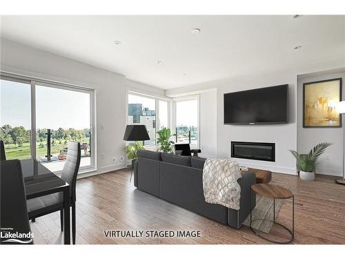 20-117 Sladden Court, Thornbury, ON - Indoor Photo Showing Living Room With Fireplace