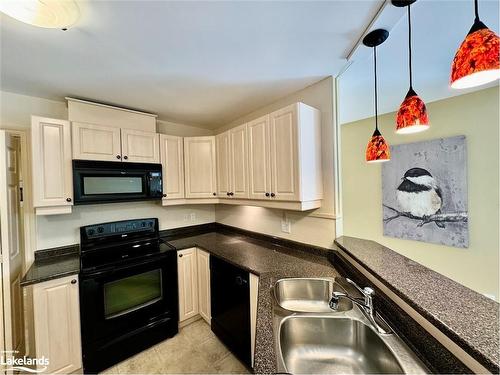 302-24 Dairy Lane, Huntsville, ON - Indoor Photo Showing Kitchen With Double Sink