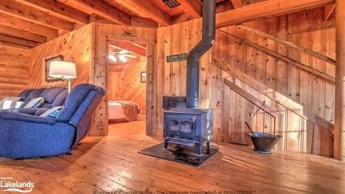 30 Mcvittie Island, Bracebridge, ON - Indoor With Fireplace