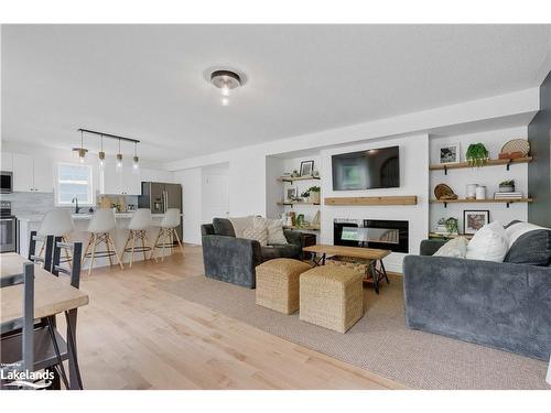 96 Fieldstream Chase Chase, Bracebridge, ON - Indoor Photo Showing Living Room With Fireplace