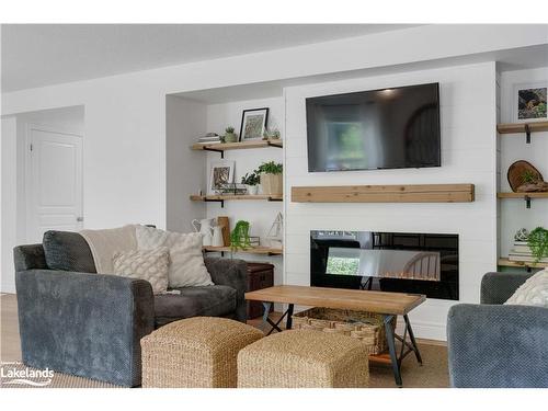 96 Fieldstream Chase Chase, Bracebridge, ON - Indoor Photo Showing Living Room With Fireplace