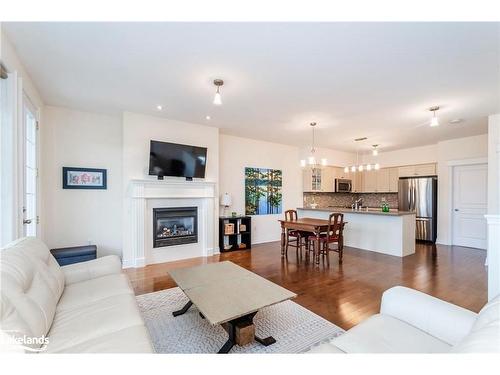 145 Wycliffe Cove, Victoria Harbour, ON - Indoor Photo Showing Living Room With Fireplace