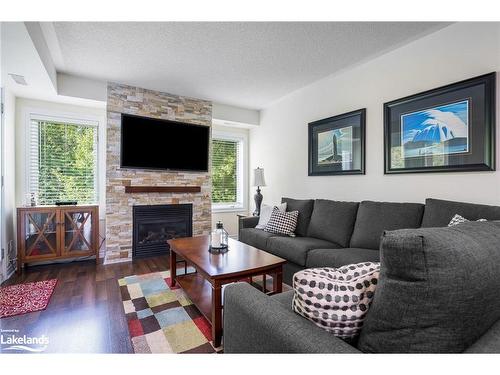 202-4 Brandy Lane Drive, Collingwood, ON - Indoor Photo Showing Living Room With Fireplace