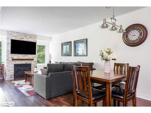 202-4 Brandy Lane Drive, Collingwood, ON - Indoor Photo Showing Dining Room With Fireplace