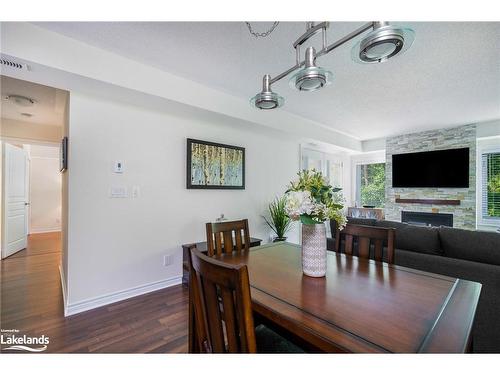 202-4 Brandy Lane Drive, Collingwood, ON - Indoor Photo Showing Dining Room With Fireplace